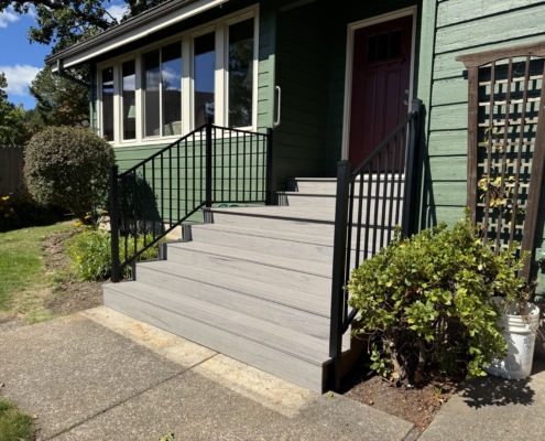 composite decking stairs with black metal railings