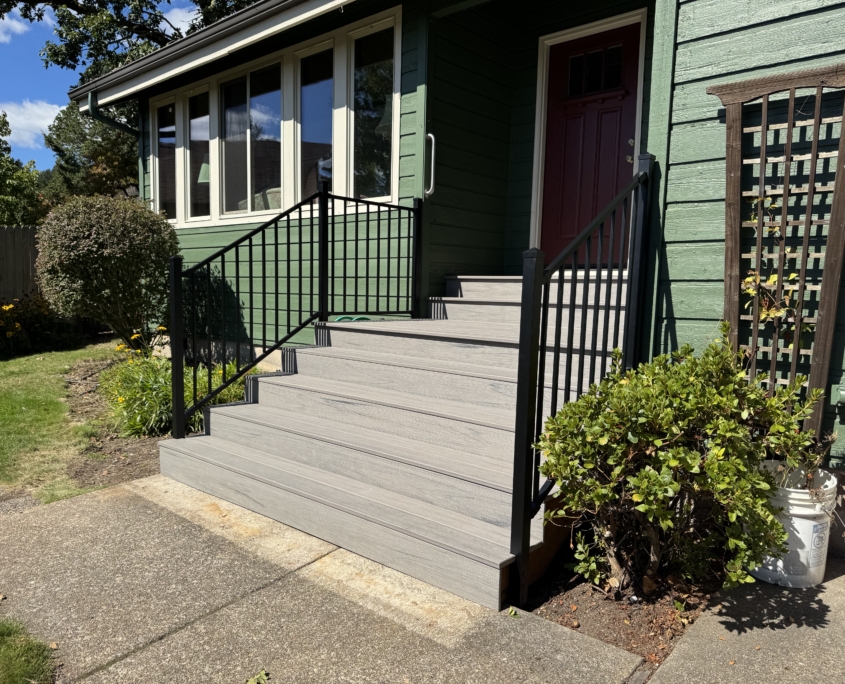 composite decking stairs with black metal railings