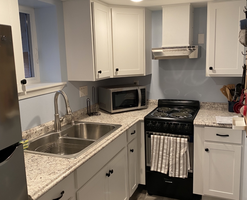 A compact kitchen space in a basement ADU